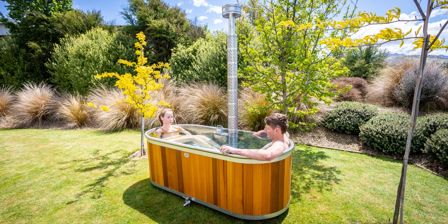 Wood-Fired Bath beside a pond